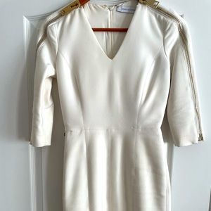 Kimora Lee Simmons white dress with gold zippers